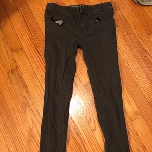 Dark green American eagle pants.